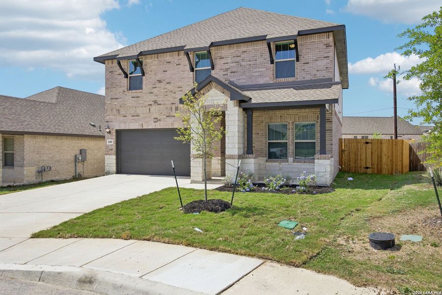 Front exterior of a new home in Arcadia Ridge - Premier Series, San Antonio, TX, highlighting curb appeal (Image 27).