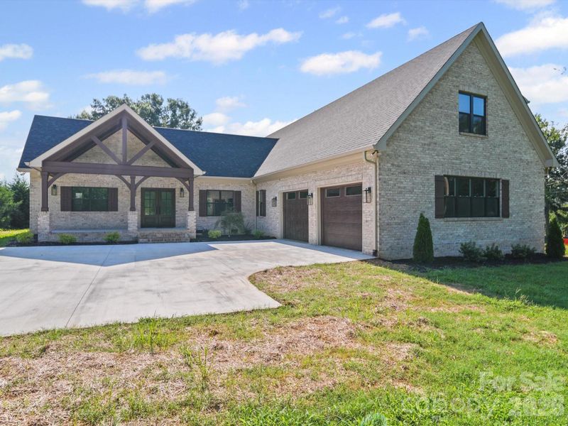 Front exterior of a new home in , Indian Trail, NC, highlighting curb appeal (Image 1). Front exterior of a new home in , Indian Trail, NC, highlighting curb appeal (Image 1).