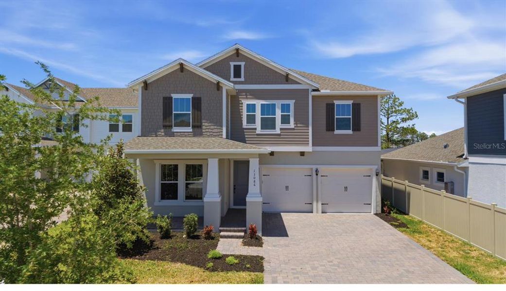 Front exterior of a new home in , Winter Garden, FL, highlighting curb appeal (Image 25).