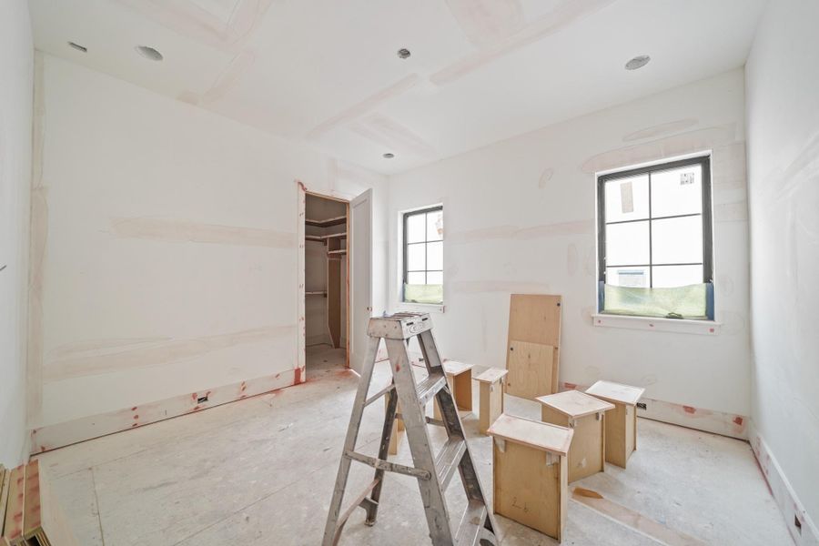The next secondary bedroom enjoys east-facing windows and a walk-in closet!
