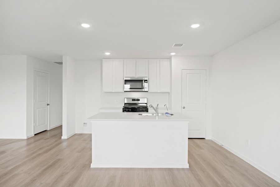 Furnished interior view inside a new home in Sunterra Lakes, Brookshire (Image 3).