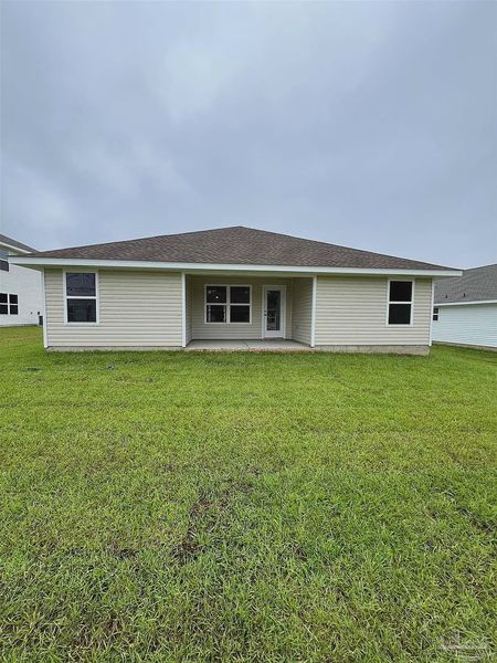 Front exterior of a new home in Pine Top, Cantonment, FL, highlighting curb appeal (Image 2).