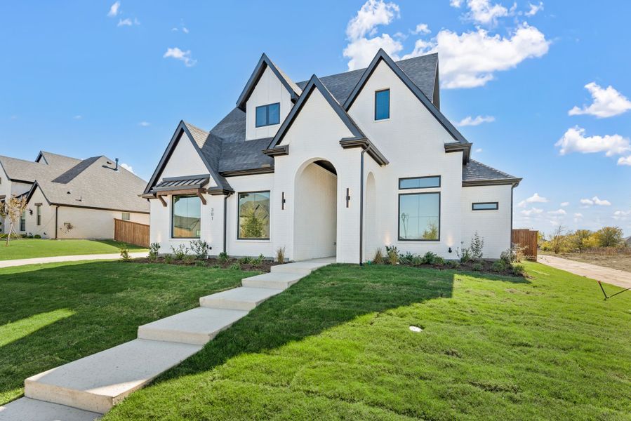Front exterior of a new home in NorthGlen, Haslet, TX, highlighting curb appeal (Image 28).
