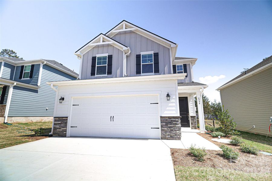 Front exterior of a new home in , Denver, NC, highlighting curb appeal (Image 1). Front exterior of a new home in , Denver, NC, highlighting curb appeal (Image 1).