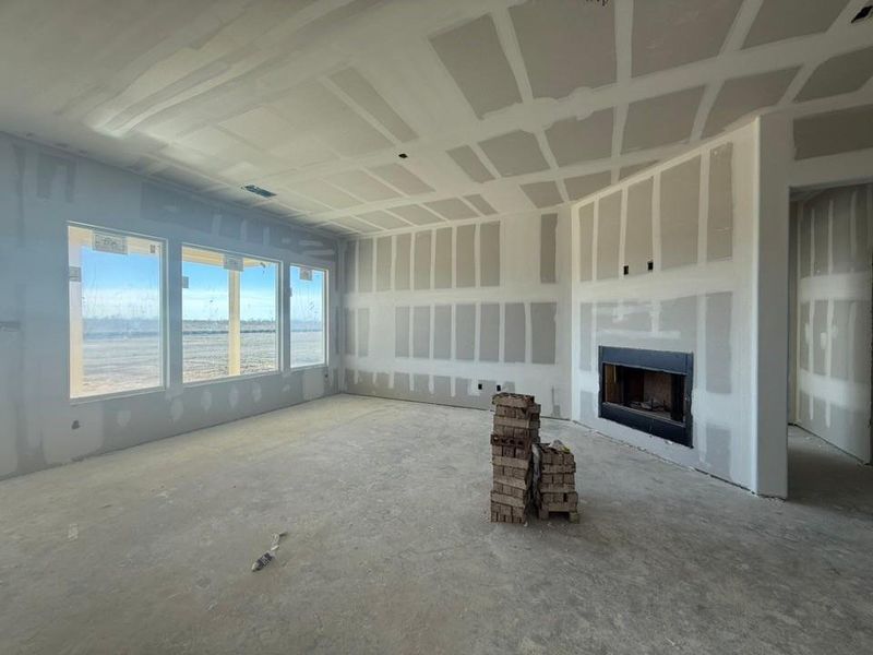 Unfurnished living room featuring a fireplace