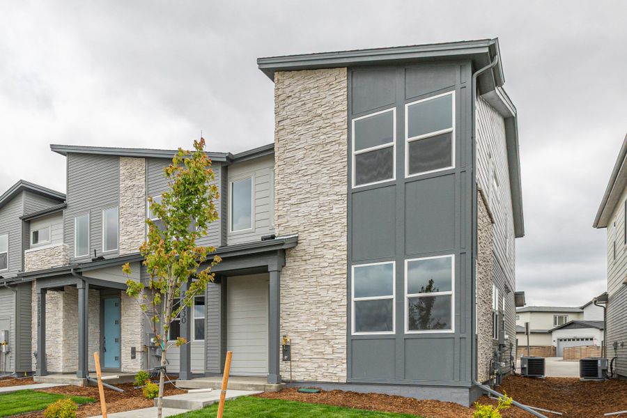 Front exterior of a new home in Painted Prairie, Aurora, CO, highlighting curb appeal (Image 24).