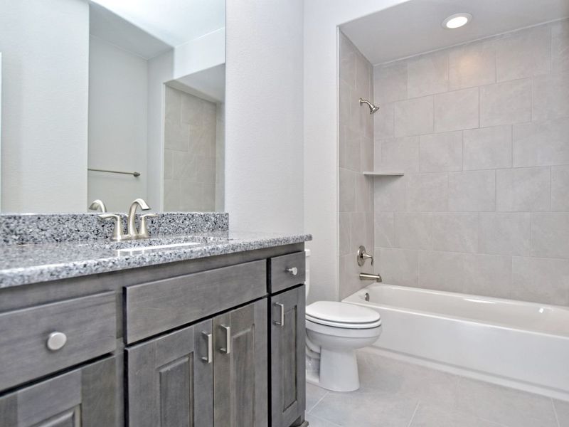 Representative furnished interior of a home built from the Madera II by Giddens Homes in Scofield Farms Estates, Georgetown (Image 166).