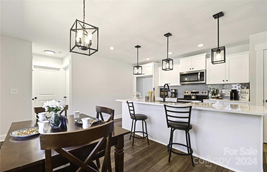 Dining area fits a large Table & breakfast bar.