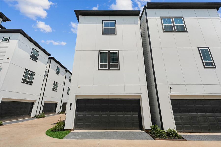 Exterior details and patio area of a home in The Corner At Buffalo Pointe, Houston (Image 1). Exterior details and patio area of a home in The Corner At Buffalo Pointe, Houston (Image 1).