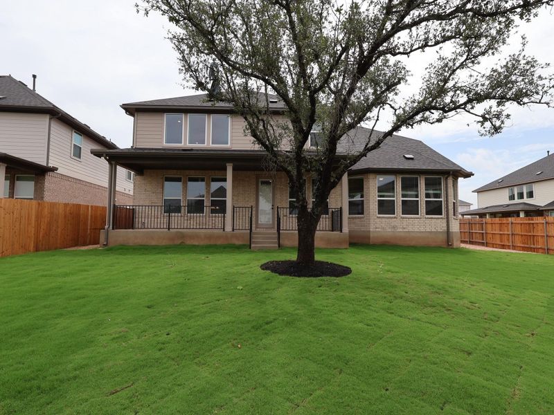 Front exterior of a new home in Edgewood, Leander, TX, highlighting curb appeal (Image 20). Front exterior of a new home in Edgewood, Leander, TX, highlighting curb appeal (Image 20).