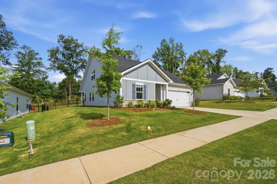 Front exterior of a new home in , Charlotte, NC, highlighting curb appeal (Image 22).