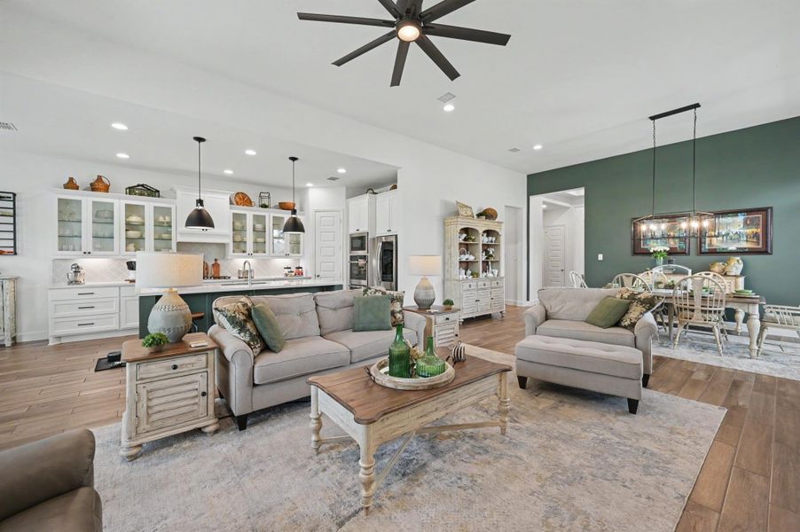 This view showcases the open living area and proximity to the kitchen. What a beautiful space with all the custom touches. This view showcases the open living area and proximity to the kitchen. What a beautiful space with all the custom touches.