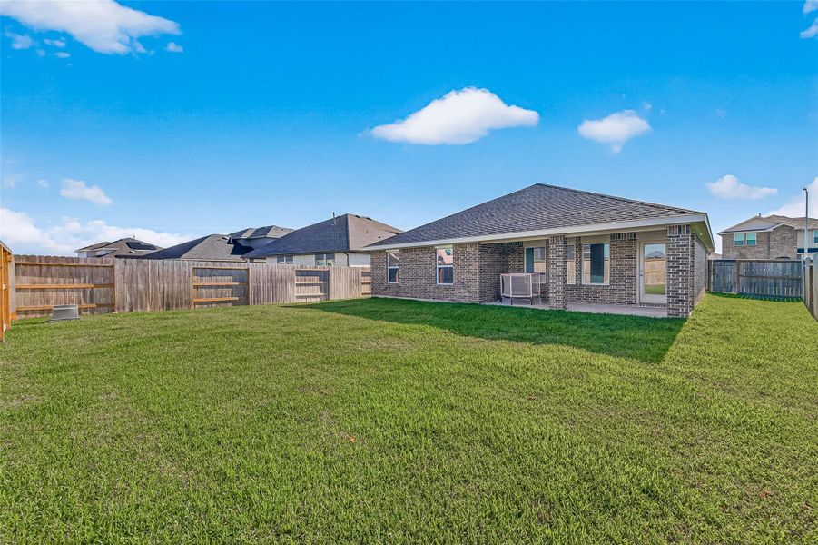 Exterior details and patio area of a home in Sunterra, Katy (Image 3).