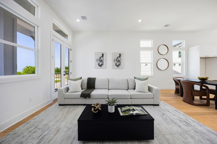 Elegant open-concept dining and living area with modern finishes and abundant natural light.