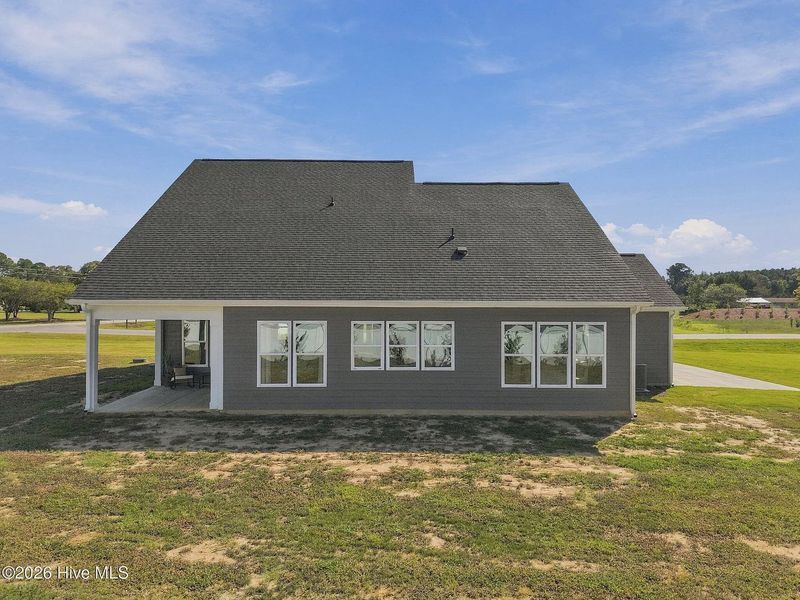 Exterior details and patio area of a home in Dixon Grove, Grimesland (Image 30).