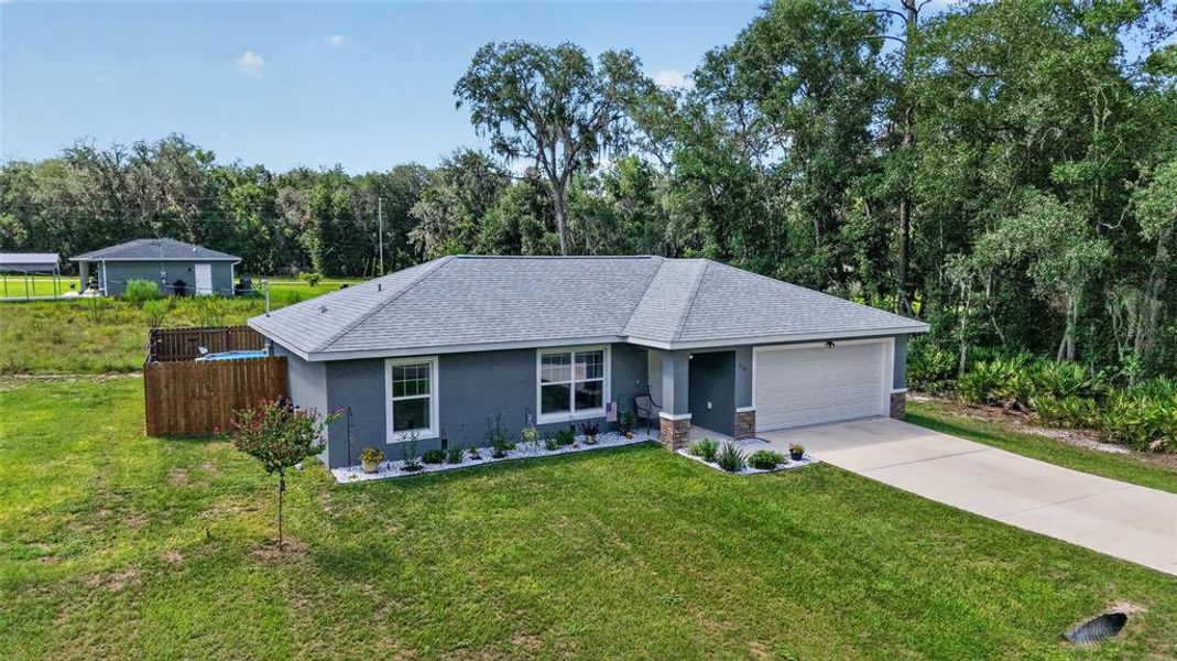 Front exterior of a new home in , Ocala, FL, highlighting curb appeal (Image 1). Front exterior of a new home in , Ocala, FL, highlighting curb appeal (Image 1).