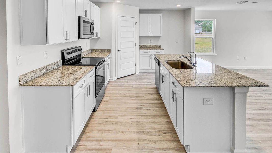 Representative furnished interior of a home built from the Lismore by D.R. Horton in Ashton Park Phase III, Freeport (Image 8).