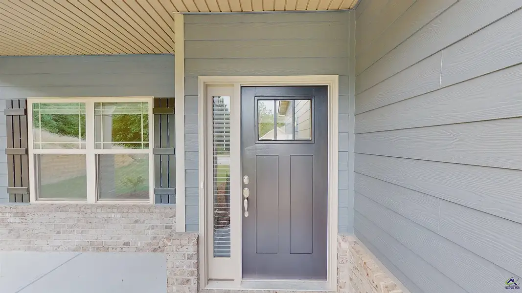Front exterior of a new home in Oakview Estates, Macon, GA, highlighting curb appeal (Image 2). Front exterior of a new home in Oakview Estates, Macon, GA, highlighting curb appeal (Image 2).