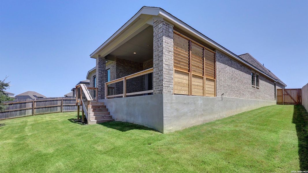 Exterior details and patio area of a home in Ladera, San Antonio (Image 25).