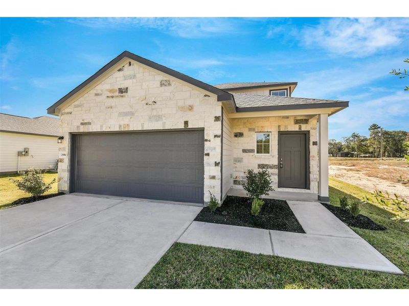 Front exterior of a new home in Liberty Estates, Cleveland, TX, highlighting curb appeal (Image 1). Front exterior of a new home in Liberty Estates, Cleveland, TX, highlighting curb appeal (Image 1).