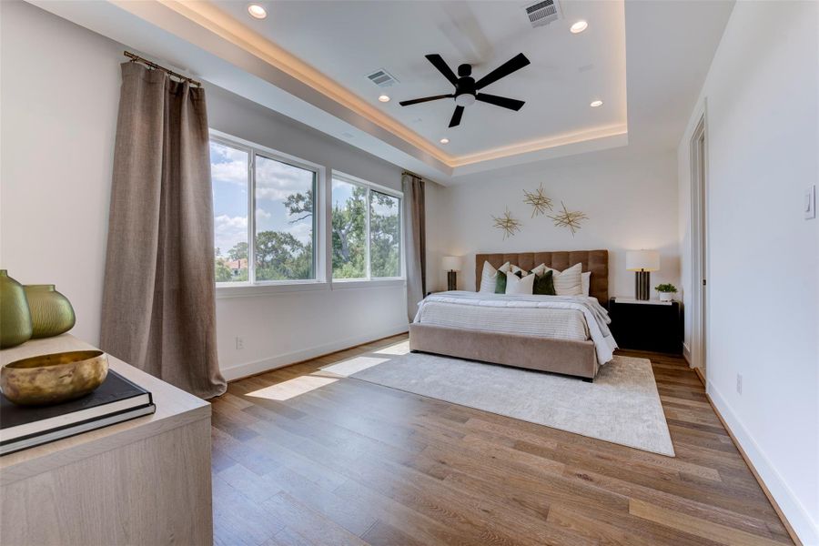 Enormous, stunning primary bedroom on the third floor. Abundant natural light.