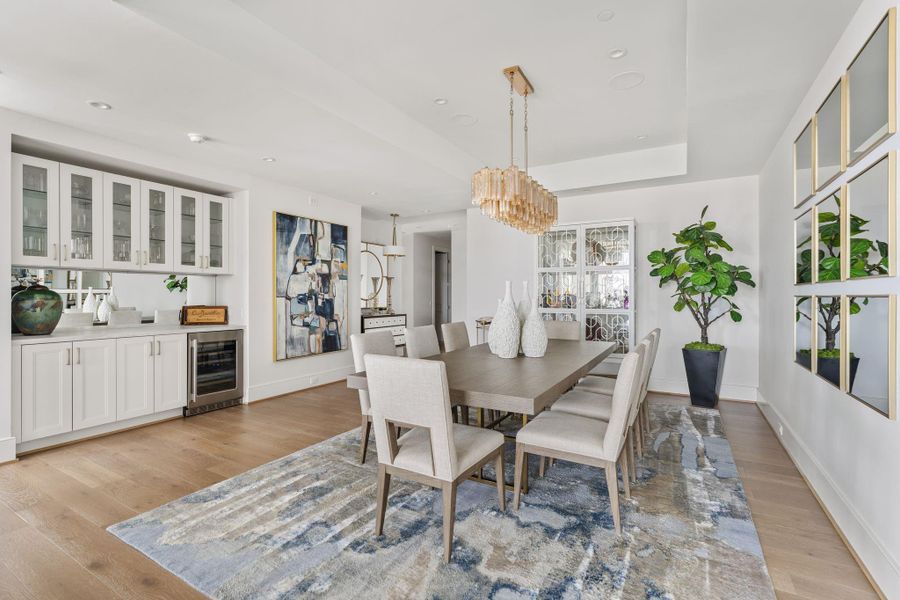 Defined by its scale and refined by its details, this dining space reimagines high-rise hospitality. The built-in wine storage and dry bar act as a sophisticated anchor to the room, framed by floor-to-ceiling glass that makes the city lights your dinner guests. It’s where grand proportions meet intimate moments, and where there is always, always an extra seat at the table for a friend. Defined by its scale and refined by its details, this dining space reimagines high-rise hospitality. The built-in wine storage and dry bar act as a sophisticated anchor to the room, framed by floor-to-ceiling glass that makes the city lights your dinner guests. It’s where grand proportions meet intimate moments, and where there is always, always an extra seat at the table for a friend.