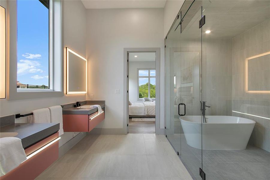 Full bathroom with vanity, a soaking tub, a stall shower, ensuite bathroom, and tile patterned floors