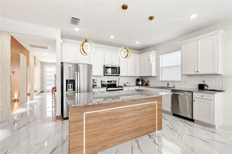 Furnished interior view inside a new home in EverBe, Orlando (Image 12).