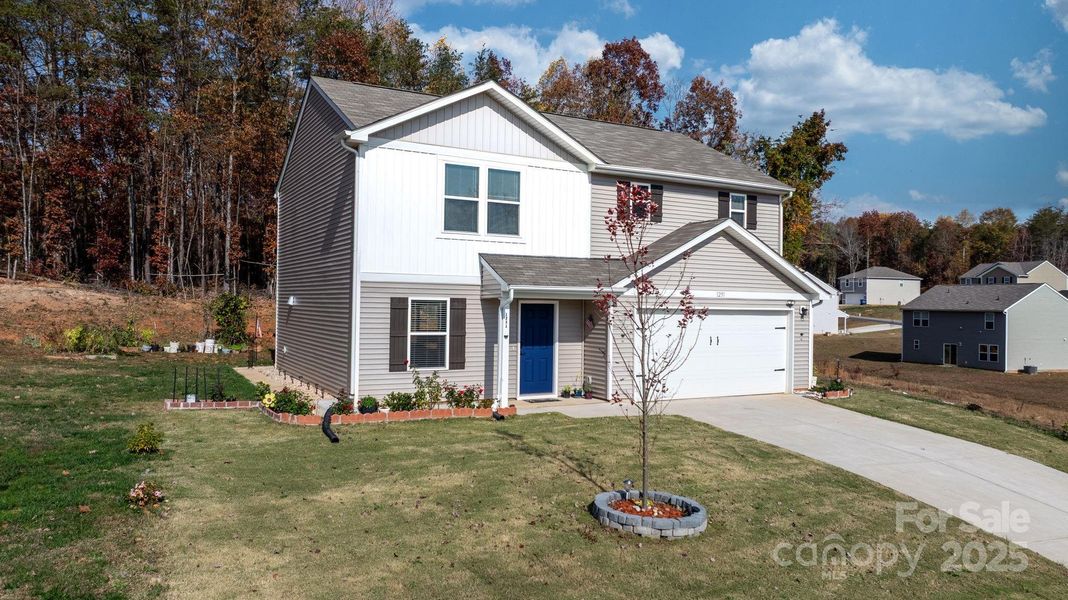 Front exterior of a new home in , Lenoir, NC, highlighting curb appeal (Image 25).
