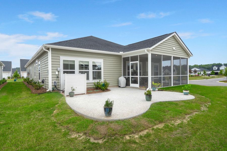 Front exterior of a new home in Horizons at Summers Corner | 55+: The Legends, Summerville, SC, highlighting curb appeal (Image 2).