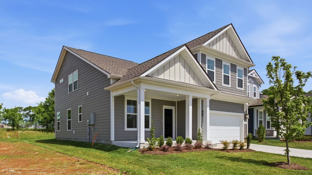 Home exterior with two-car garage and black door Home exterior with two-car garage and black door