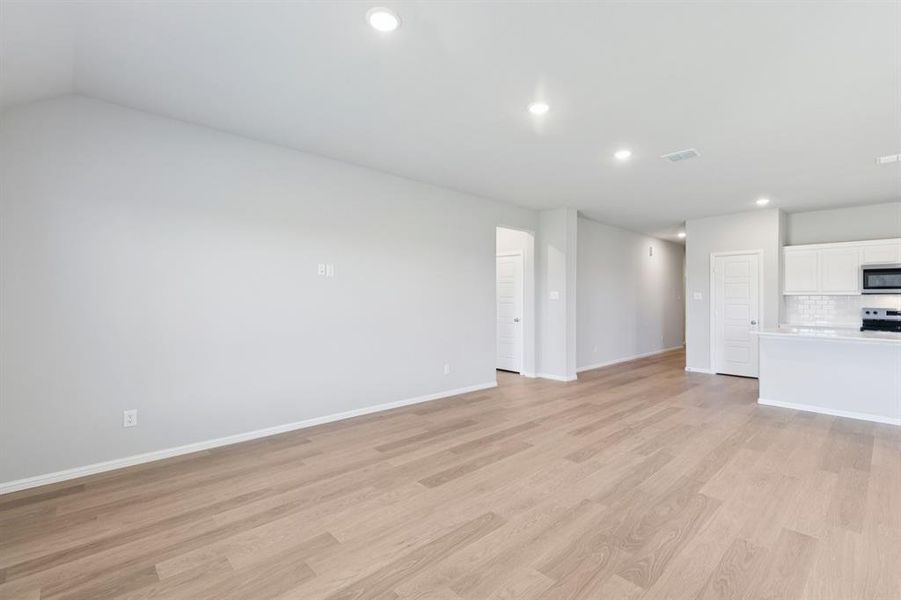 Living Room in the Harrison home plan by Trophy Signature Homes – REPRESENTATIVE PHOTO Living Room in the Harrison home plan by Trophy Signature Homes – REPRESENTATIVE PHOTO