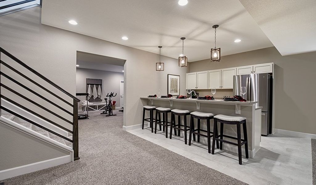 RidgeAtSouthshore-DEN-Powell Basement Bar and Fitness Room