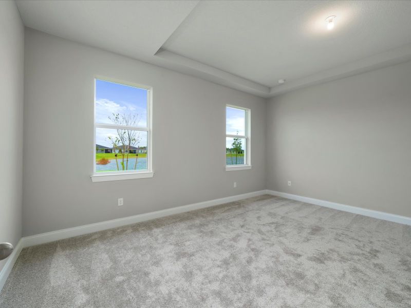 Primary Bedroom in the Coral floorplan at 6295 NW Sweetwood Drive in Brystol at Wylder