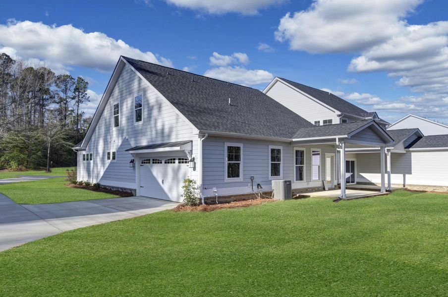 Front exterior of a new home in Clubside Reserve at Summerlake, Lexington, SC, highlighting curb appeal (Image 26). Front exterior of a new home in Clubside Reserve at Summerlake, Lexington, SC, highlighting curb appeal (Image 26).