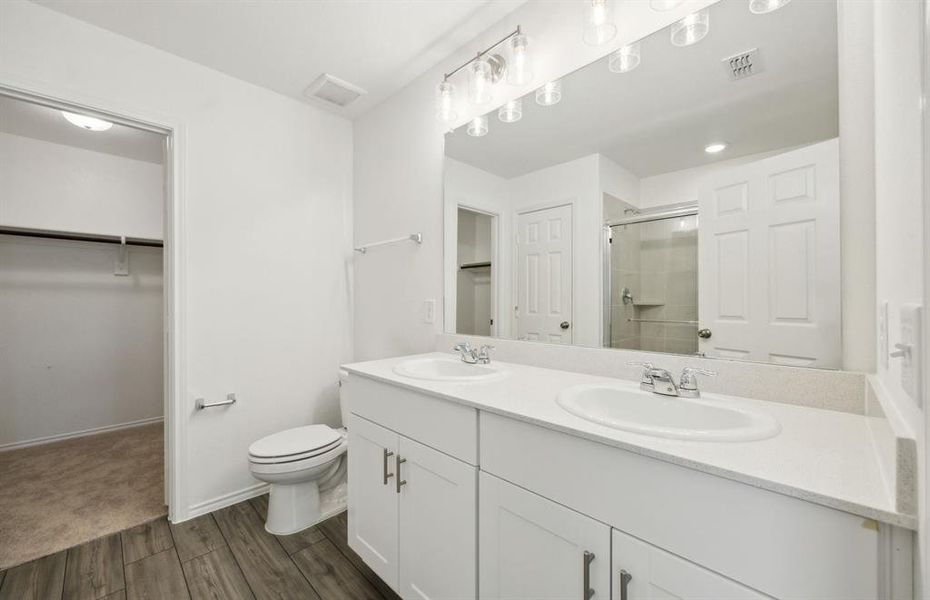 Owner's bath with dual sinks *real home pictured