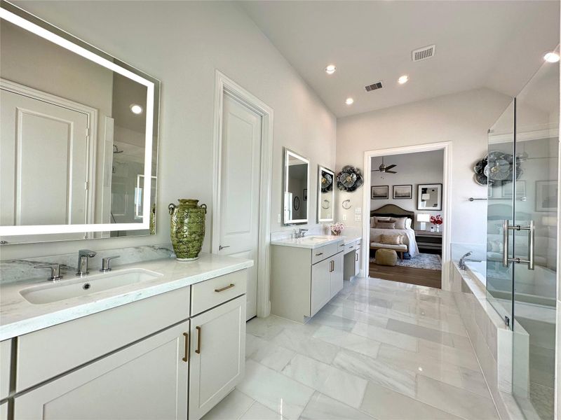 Three separate vanity locations, each with its own LED mirror.