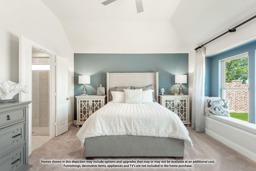 Master bedroom with vaulted ceiling, blue accent wall, window seat, and ensuite bathroom door visible Master bedroom with vaulted ceiling, blue accent wall, window seat, and ensuite bathroom door visible