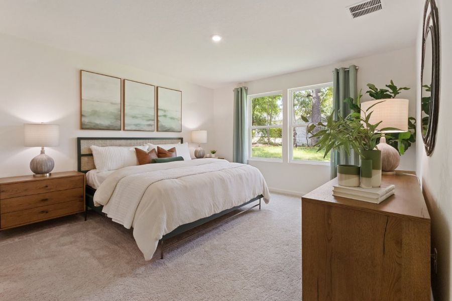 A bedroom with a bed and a window. A bedroom with a bed and a window.