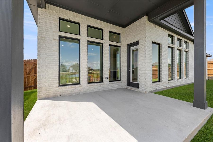 Exterior details and patio area of a home in The Parks at Panchasarp Farms - Phase 3, Burleson (Image 3). Exterior details and patio area of a home in The Parks at Panchasarp Farms - Phase 3, Burleson (Image 3).
