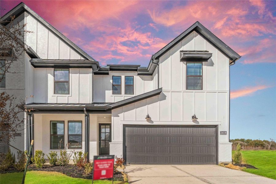 Front exterior of a new home in Elyson, Katy, TX, highlighting curb appeal (Image 2). Front exterior of a new home in Elyson, Katy, TX, highlighting curb appeal (Image 2).