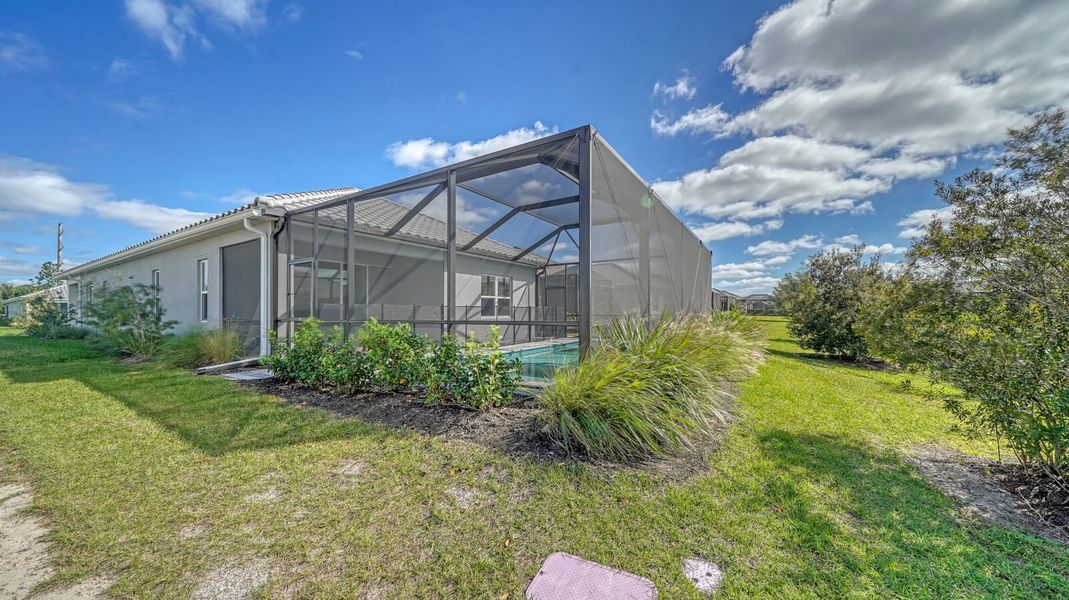 Exterior details and patio area of a home in Windward, Sarasota (Image 16).