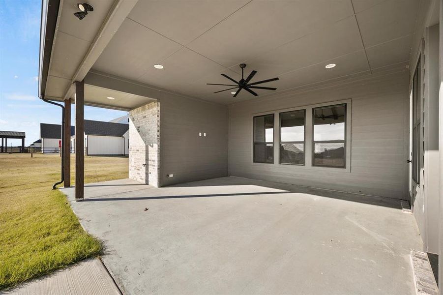 View of patio featuring ceiling fan