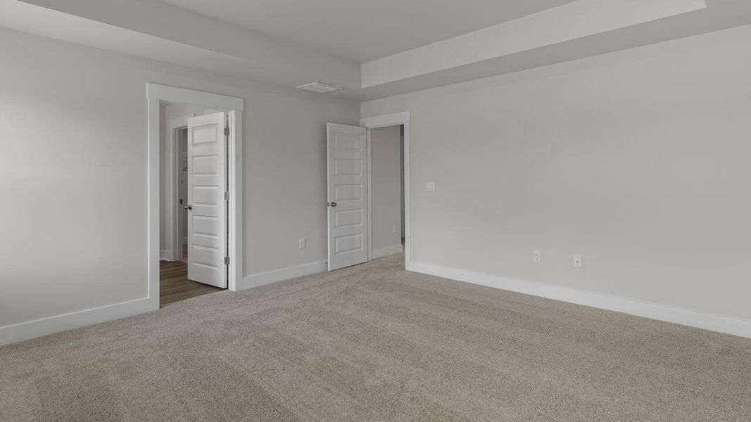 Spacious, unfurnished interior of a new home in Surfside Landing, Hubert (Image 24).