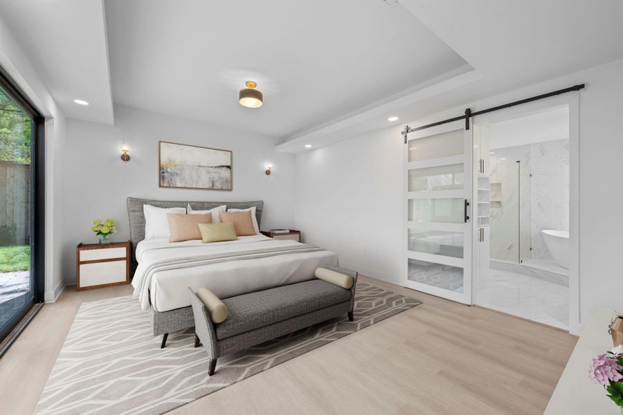 Virtually Staged: Unwind in this fantastic master bedroom with engineered wood floors, a tray ceiling, and a sliding door en route to your bath. Virtually Staged: Unwind in this fantastic master bedroom with engineered wood floors, a tray ceiling, and a sliding door en route to your bath.
