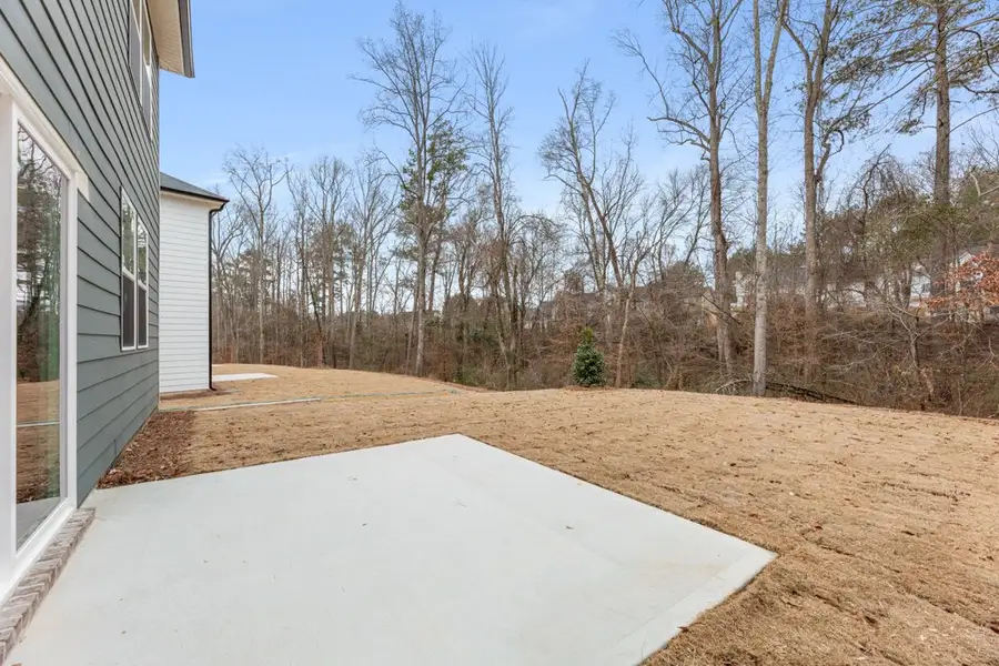 A dirt path next to a house. A dirt path next to a house.