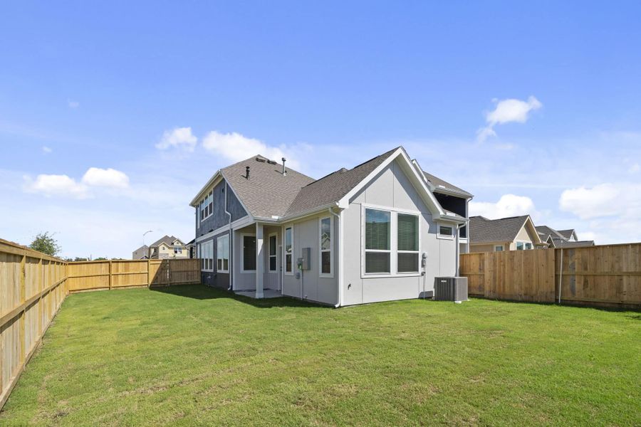 Exterior details and patio area of a home in Meridiana, Manvel (Image 4).