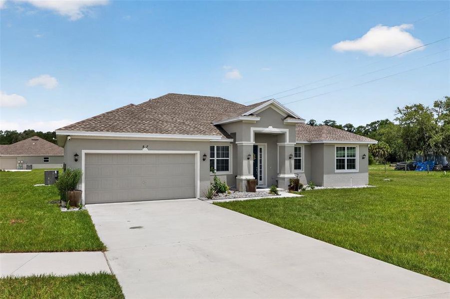 Front exterior of a new home in , Bartow, FL, highlighting curb appeal (Image 22). Front exterior of a new home in , Bartow, FL, highlighting curb appeal (Image 22).