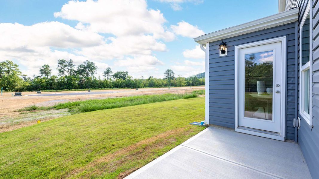 Front exterior of a new home in Hawk's Ridge, Rossville, GA, highlighting curb appeal (Image 20).