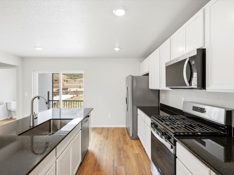 Furnished interior view inside a new home in Three Hills, Morrison (Image 5).